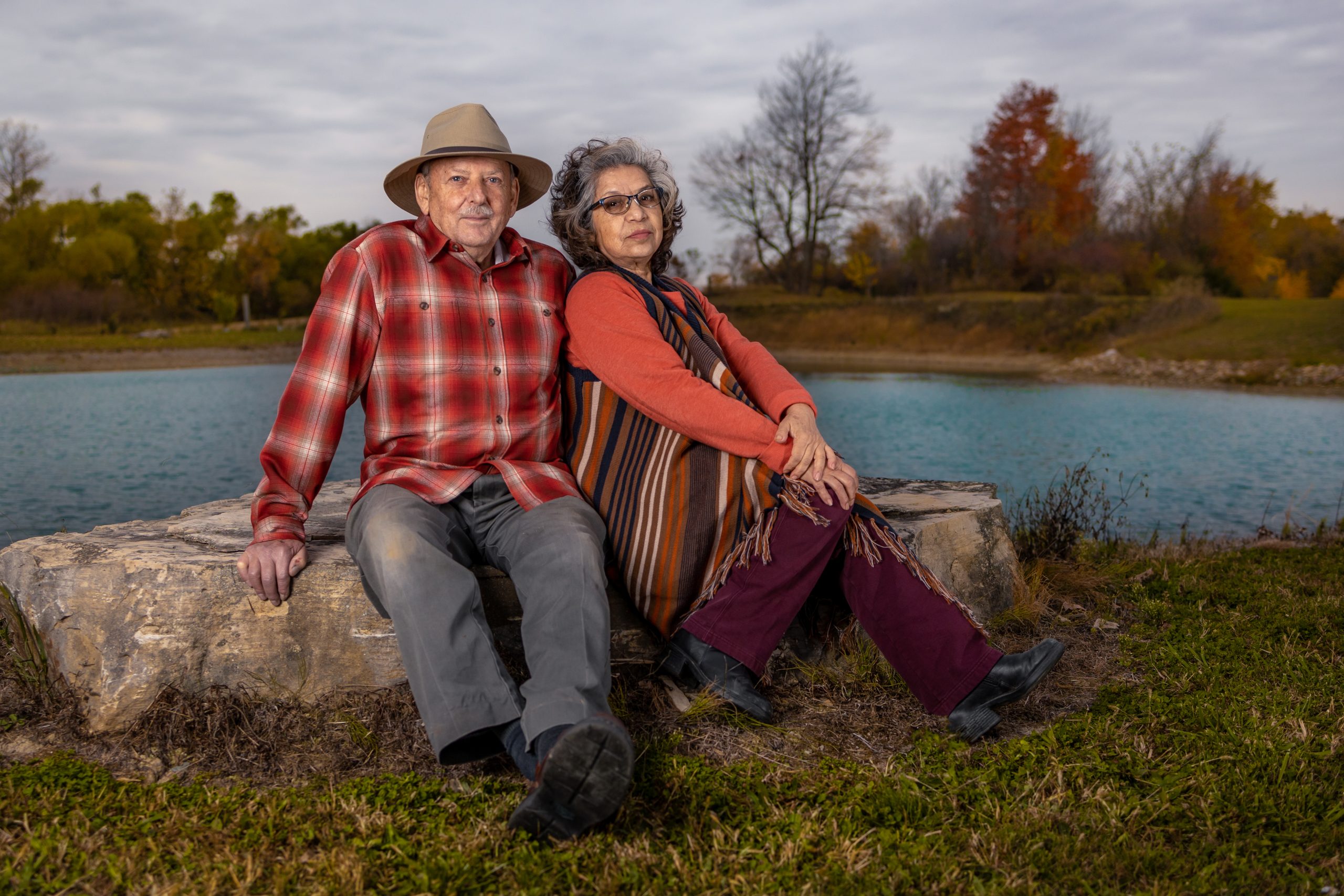 parents sitting rock-